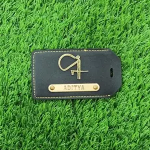 Black luggage tag attached to suitcase for quick and secure baggage identification
