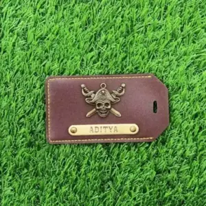 Dark Brown luggage tag attached to suitcase for quick and easy baggage identification