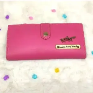 Stylish ladies 2 fold button wallet in peach colour with compartments