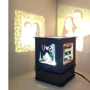 A customized Rotating Shadow Box featuring personalized photos with a rotating mechanism and LED illumination for a modern decorative display.