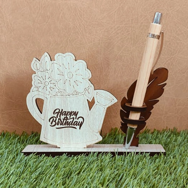 Personalized Birthday Pen Stand with floral watering can design, custom name engraved wooden pen holder, birthday desk organizer, MDF wood pen stand, office table accessory, personalized gift, and decorative desk organizer.