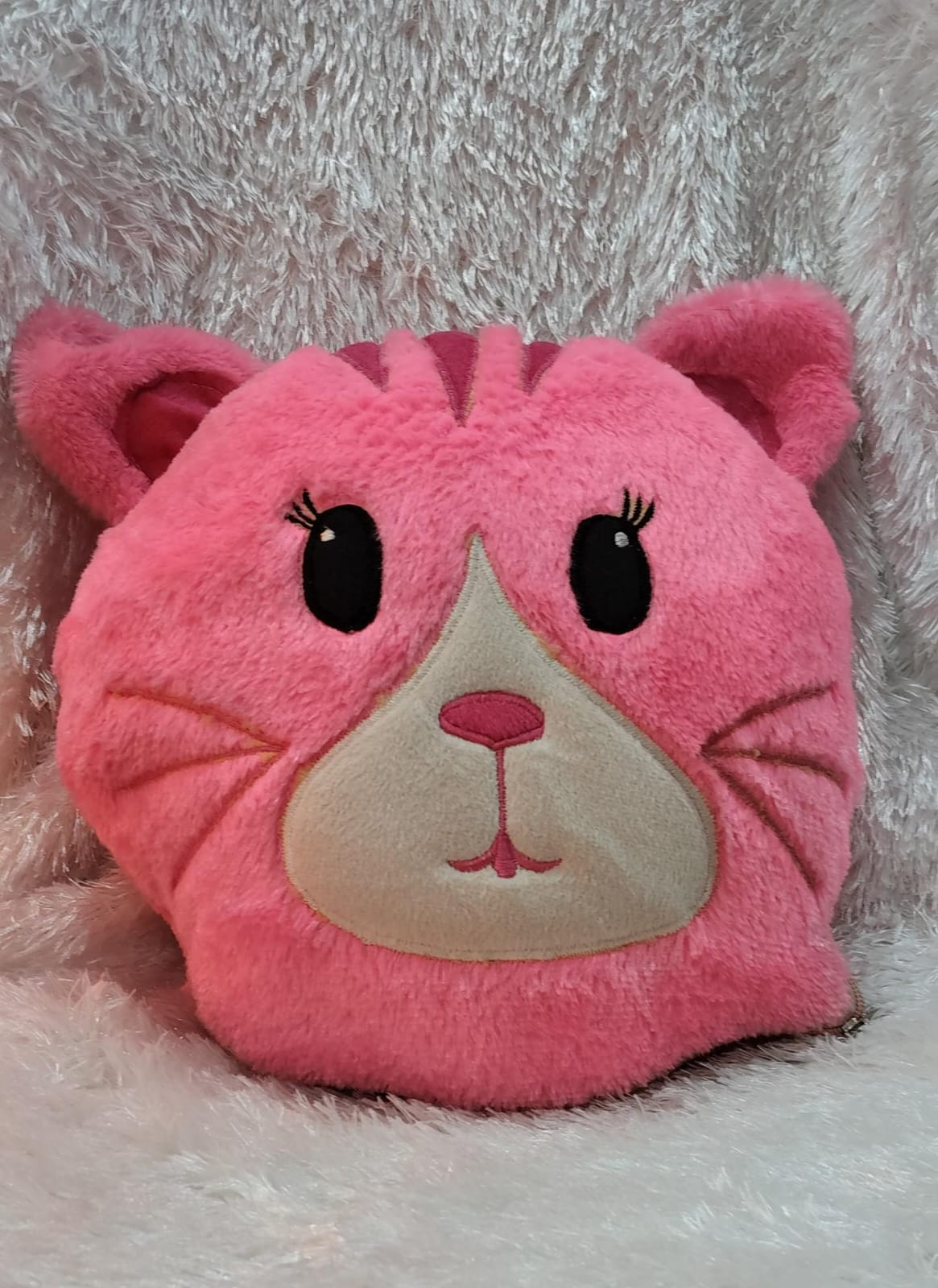 Pink cat cushion made from soft plush fabric with cute animal face design for kids room décor, gifting, and comfortable everyday use.